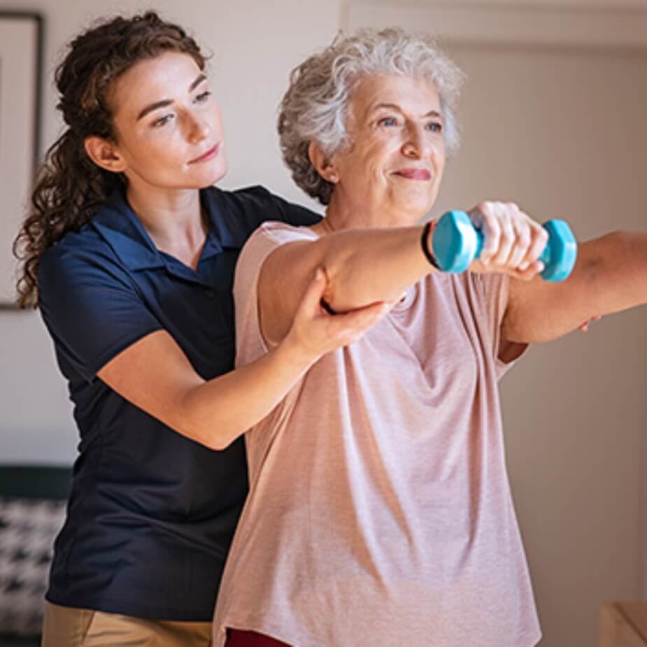 therapist helping a patient at home