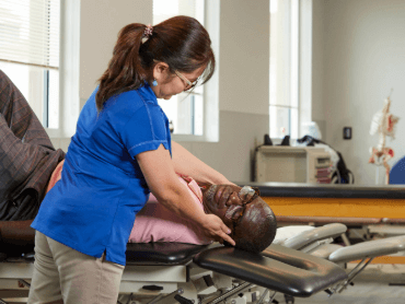 Therapist with patient working on neck