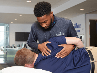 Therapist with patient working on shoulder