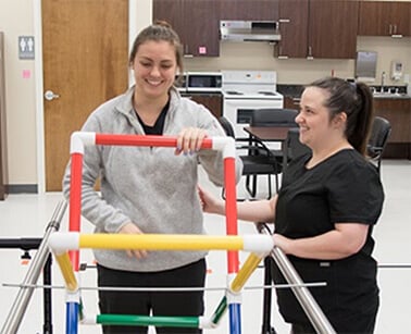 Female patient exercising in a Day Neuro center.