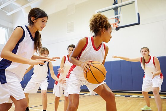 Girls playing basketball.