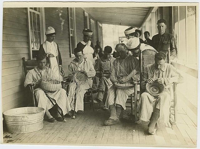 Soldiers recovering from severe wounds learn basket weaving as a form of occupational therapy