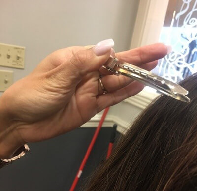 close-up of a person's hand grasping an object